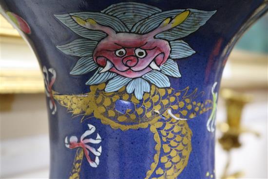A pair of large Chinese blue ground dragon and phoenix vases, 19th century, restorations